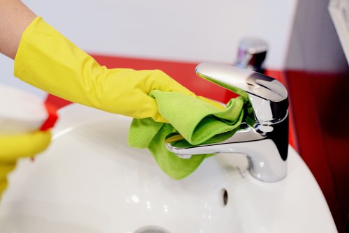 Local technician cleaning a sofa in Chiswick with specialist equipment